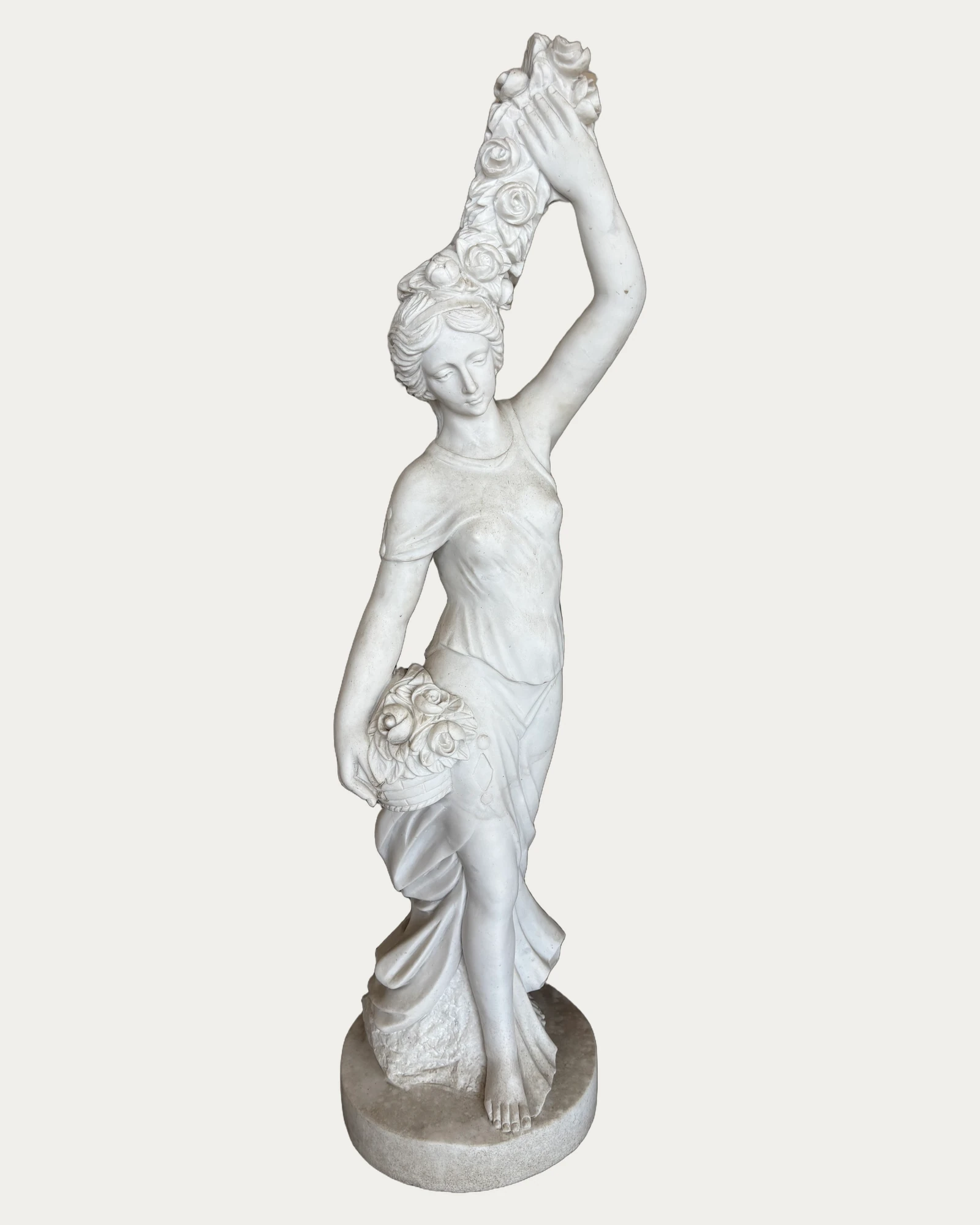 Woman with Raised Floral Garland Statue, three-quarter view