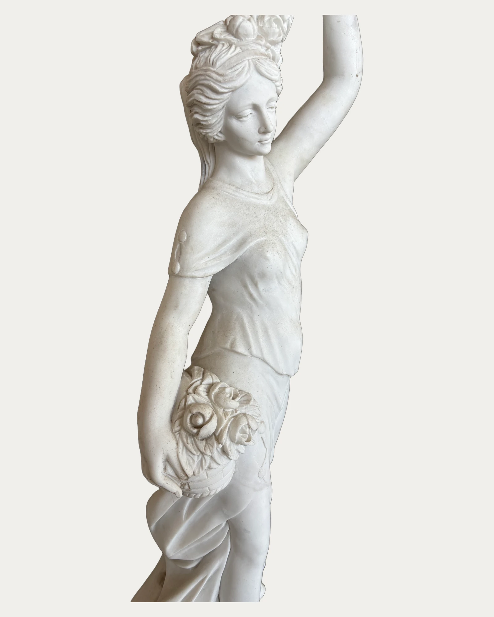 Woman with Raised Floral Garland Statue, carving and surface detail 2